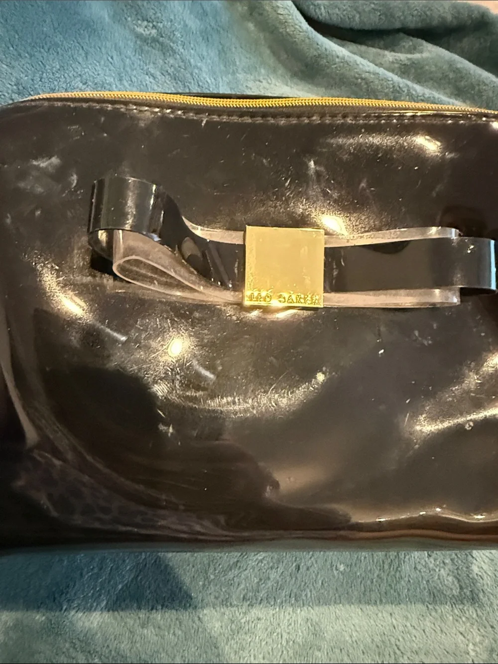 Ted Baker Patent Bow Cosmetic Clutch in Black with Gold Accent
